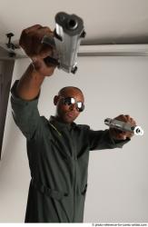 ERIC STANDING POSE WITH GUNS